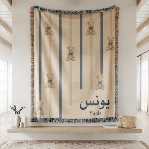 Distant view of the Personalized Teddy Bear Navy Ribbon Arabic Boy blanket, displayed flat on a wall, highlighting the entire teddy bear and ribbon pattern.