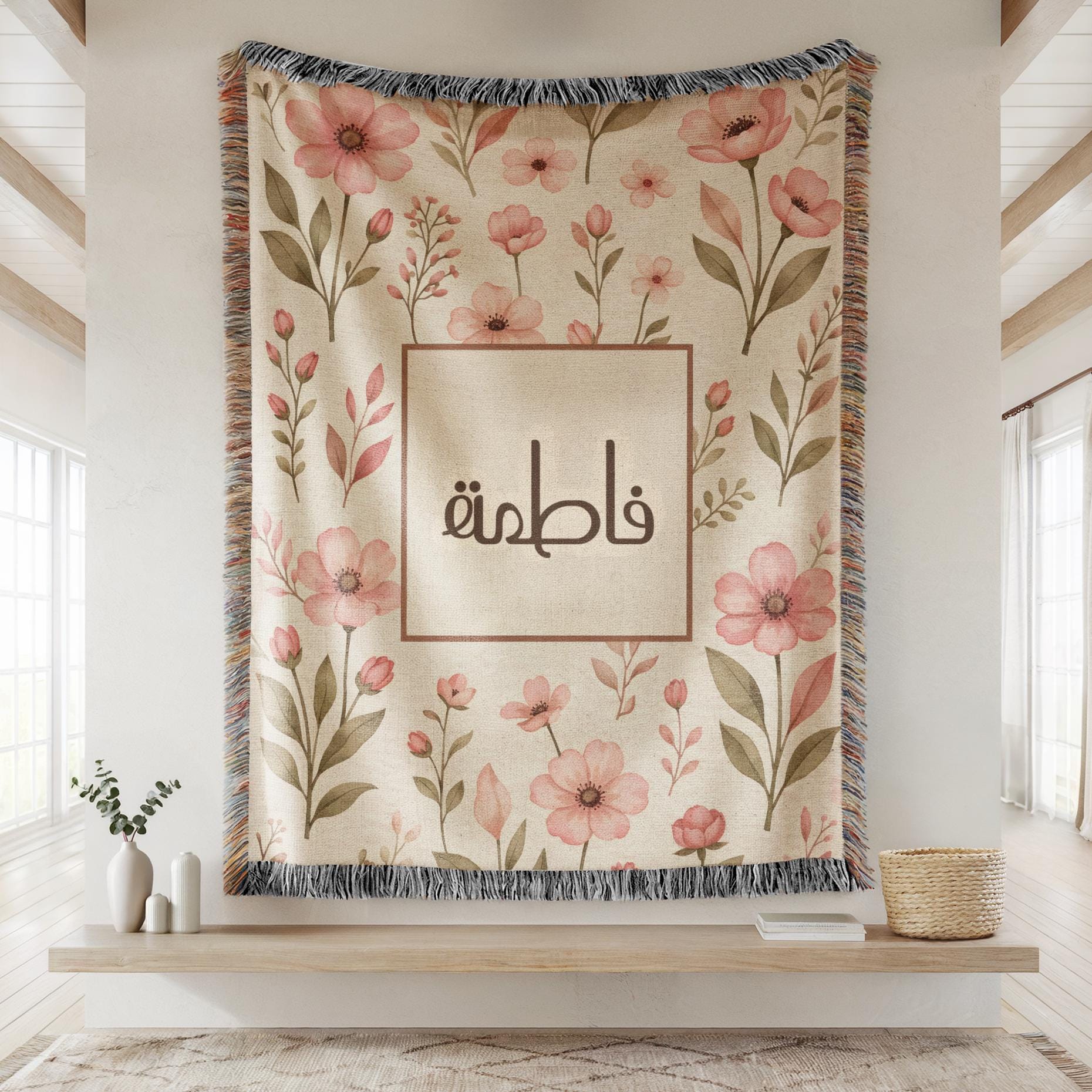 The luxury Floral Arabic Baby Girl heritage throw blanket hanging flat from a wooden dowel above potted plants against a modern living room wall.