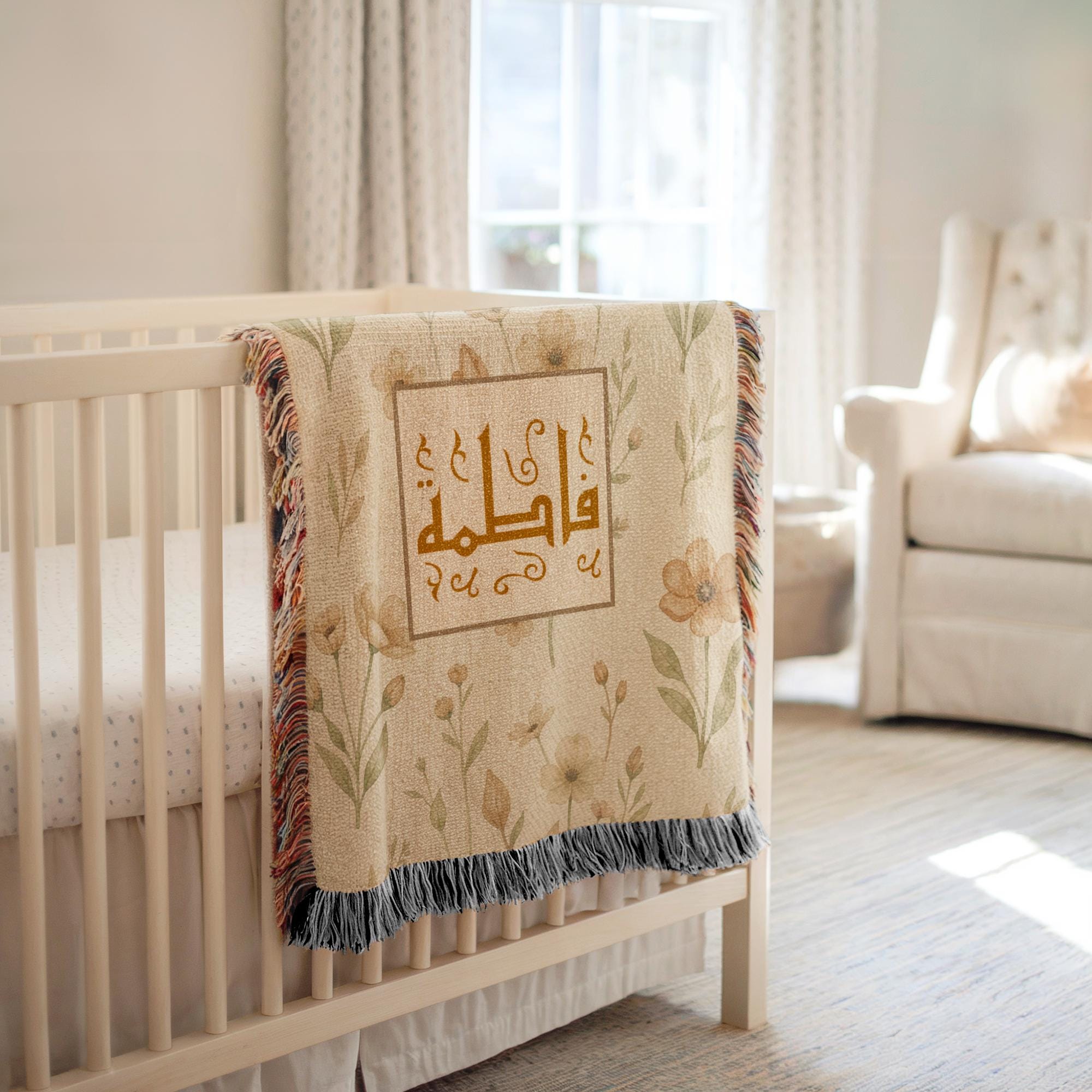 Classic Framed Arabic Calligraphy blanket draped over a white crib, with a plush teddy bear and a brightly lit nursery background.